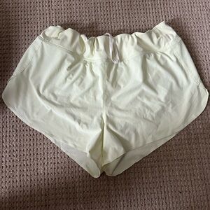 Athleta yellow running shorts with liner